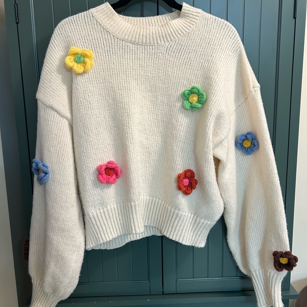 Cozy White Sweater with Colorful Floral Accents